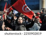 Small photo of Tunis, Tunisia, a woman raising the Tunisian flag during a protest against the tunisian president by Ennahda Party in Tunis, Tunisia on 13 February 2022. (Photo by Mohamed Soufi)