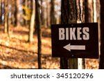 Bike Trail And Sign In The Woods