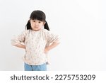 Angry Asian child on white background