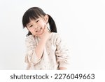 Cute asian child on white...