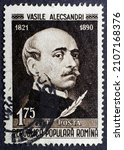 Small photo of MADRID, SPAIN - JANUARY 16, 2022. Vintage stamp printed in Romania shows Vasile Alecsandri (1821 - 1890), a Romanian poet, dramatist, politician and diplomat