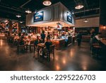Small photo of Nashville, TN, USA - April 2nd, 2023: People eating inside the Assembly Food Hall, a famous food court in downtown Broadway area of Nashville at night