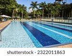 Small photo of Sao Paulo, SP, Brazil - June 21st, 2023: Swimming pool complex of Esporte Clube Pinheiros (ECP), private sports club in Brazil with pool for kids, water polo and olympic pool with chairs around them