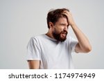Small photo of forgetfulness man touches his head with his hand scatteredness absent-mindedness