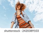 Happy Woman on Beach, Smiling with Open Mouth, Enjoying Freedom and Nature: Portrait of Young Model with Curly Hair in Wide Angle Lens Close-up