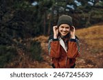 Smiling woman in beanie hat...