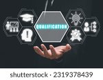 Small photo of Qualification concept, Person hand holding qualification icon on virtual screen.