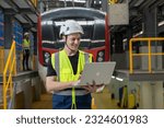 Small photo of Portrait of Engineer train Inspect the Railway Electrification System track in depot of train