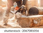 Small photo of Close-up chainsaw of woodcutter sawing chain saw in motion, sawdust fly to sides. Concept is to bring down trees.