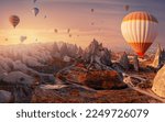 Small photo of Landscape sunrise with hot air balloons fly over deep canyons, valleys Cappadocia Goreme National Park Turkey, aerial top view.