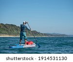 Active Man Paddling On Stand Up ...
