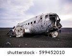Airplane wreckage on black sand beach. Iceland