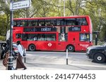 Small photo of London, UK - September 14, 2023: Red London bus with the exorcist movie advertisement before Halloween.