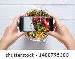 Calories counting and food control concept. woman using application on smartphone for scanning the amount of calories in the food before eat