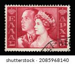 Small photo of ZAGREB, CROATIA - JULY 03, 2014: Stamp printed in Greece shows King Paul and Queen Frederica, King and Queen of Greece, circa 1956