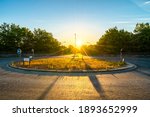 Roundabout With Sun Flare At...