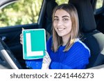 Happy young female driver showing her L sign lerner driving school in spain, ele autoescuela conductor novel