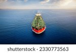 Small photo of Aerial front view of a heavy crude oil tanker traveling over calm sea during sunset
