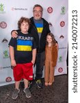 Small photo of Tom Arnold with kids Quinn Arnold, Jax Arnold attend DarkPulse Presents Comedians And Progress Humanity Against World Conflict at The Comedy Store, Hollywood, CA on March 27, 2022