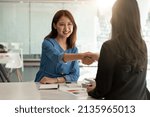 Small photo of Close up of Business people shaking hands, finishing up meeting, business etiquette, congratulation, merger and acquisition concept