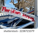 Small photo of Amidst the wreckage and destruction on Fort Myers Beach are messages of hope spray painted on mangled pieces of metal.