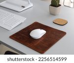 Leather Mousepad Isolated on Office Desk with White Mouse 
