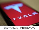 Small photo of Los Angeles - USA, 2022 January 5: Tesla Model Pi smartphone. Phone made by Elon Musk company Tesla. Tesla logo on smartphone screen