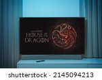 Small photo of Kaunas, Lithuania - 2022 April 10: House of Dragons TV series on big tv screen. Game of Thones house of dragons television show at home