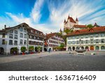 Amazing view of City Hall square and castle of Thun, Switzerland under picturesque sky. Thun city is a popular travel destination and tourist attraction in Switzerland