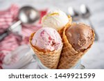 strawberry, vanilla, chocolate ice cream woth waffle cone on marble stone backgrounds