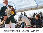 Small photo of Fair Hill, Maryland USA – October 22, 2023: Francesca Denning, groom for Colorado Blue, pets him during the prize giving ceremony at the 2023 MARS Maryland 5 Star at Fair Hill