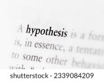 Small photo of Scientific term hypothesis printed in textbook focused in closeup of explanation