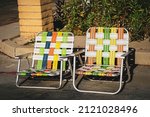 Two Empty Vintage Lawn Chairs 