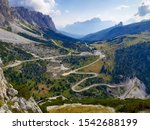 long and winding mountain road with hairpin turns in the Dolomites of Italy