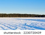 Winter landscape with  textured snow. Rural field covered with snow.