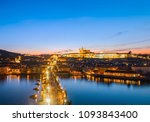 Panorama view of the Old Town architecture with Vltava river, Charles Bridge and St.Vitus Cathedral in romantic town of Prague during sunset, Czech Republic
