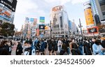 Small photo of Tokyo, Japan - Dec 7, 2022: Crowd of Japanese people, commuter, traveler walk cross road at Shibuya scramble crossing. Tourist landmark, traffic transportation, Asia transport, Asian tourism city life