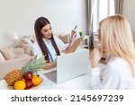 Small photo of Doctor nutritionist, dietician and female patient on consultation in the office. young smiling female nutritionist in the consultation room. Nutritionist desk with healthy fruit and measuring tape.