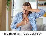 Small photo of Breathing, respiratory problem, asthma attack, pressure, chest pain, sun stroke, dizziness concept. portrait of woman received heatstroke in hot summer weather, touching her forehead