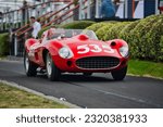 Small photo of Pebble Beach, CA USA - September 9, 2017 - A classic Ferrari motors down the viewing lane of the Pebble Beach Concourse d'Elegance