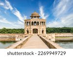 The exquisite minaret and tranquil lake at Hiran Minar, a UNESCO World Heritage Site, in Sheikhupura, Pakistan, create a truly enchanting scene. 
