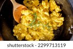 Small photo of Morning Perfection: Intimate Close-up of Fluffy Scrambled Eggs in a white plate