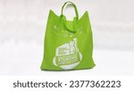 Small photo of Malang, Indonesia - October 18, 2023: The green goody bag package contains food assistance from the government to prevent stunting in children in Malang City