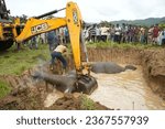 Small photo of Rani, Assam, India. 4 August 2023. Forest officials prepare to bury dead body of elephants, after death due to electrocuted in Rani Village in Assam.