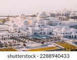 Small photo of 15 January 2023, Abu Dhabi, UAE: Aerial view of majestic white Qasr Al Watan royal palace and president residency near sea coast