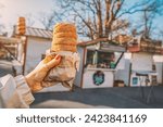 biting into a warm trdelnik, its crispy exterior giving way to a soft, doughy center infused with hints of cinnamon and sugar.