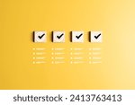 Small photo of Checklist, Task list, To-do lists, Work confirmation check, or Quality Control. Goals achievement and business success. Check marks icons on wooden blocks and jobs list symbols on a yellow background.