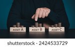 Small photo of Diversify financial risk with funds. Investment asset allocation, diversification and risk management. Hand chooses on stacking coins with words ASSET A, B, C on wooden blocks. Real estate investment.