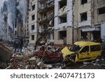 Small photo of Kyiv, Ukraine - January 2th 2024 - In the early hours Russia launched missile attacks to Kyiv, local officials reported. Rescuers work at the site of a damaged building after a missile strike.