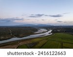 Small photo of Watershed of the Odejouca and Arade rivers in South Portugal, connection of these rivers, view of the mountains and Portimao on the Atlantic Ocean during sunrise
